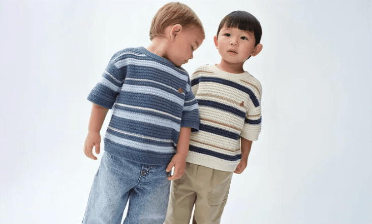 Two boys in striped sweaters